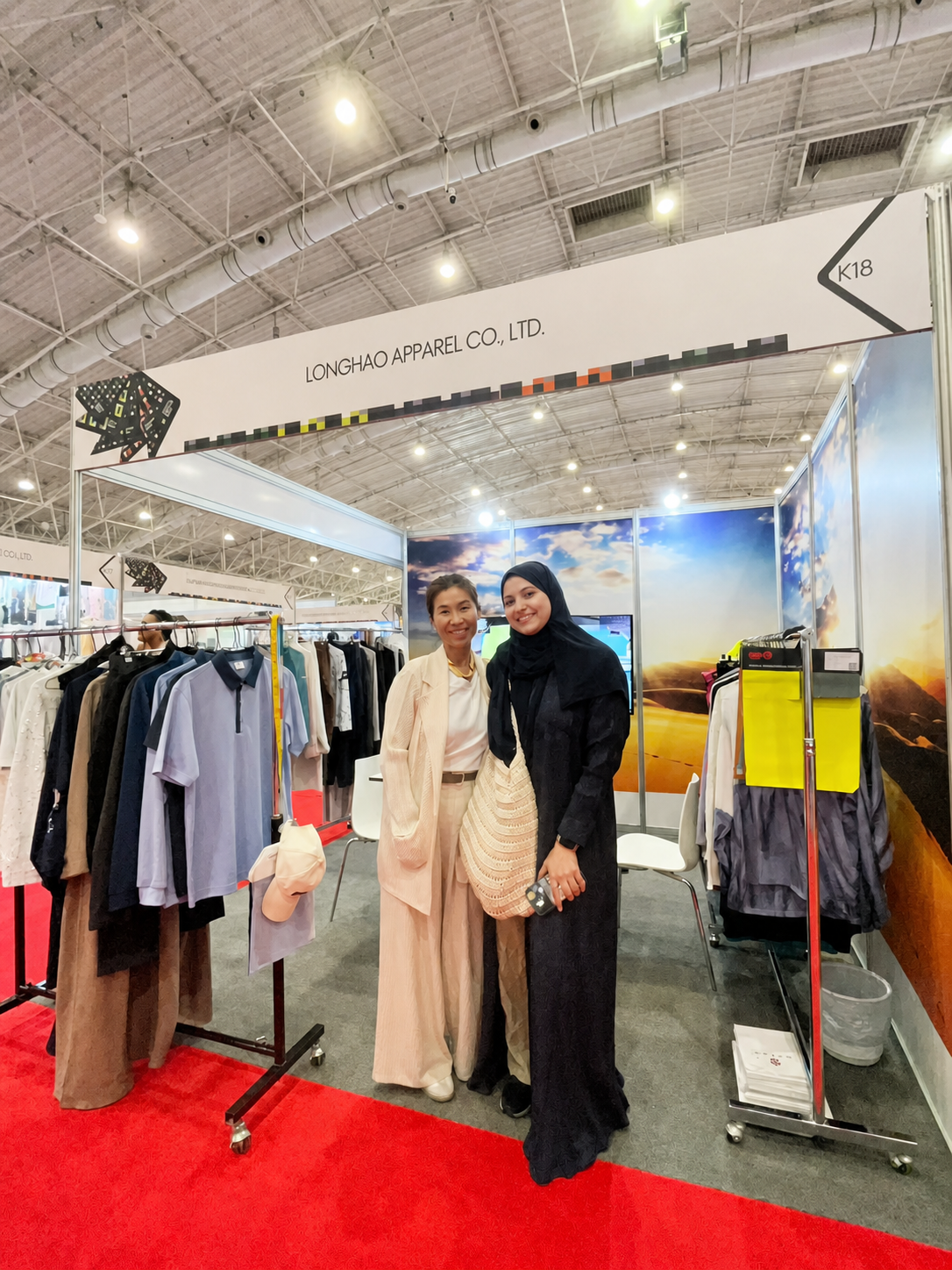 Longhao Apparel presenting finished garments to international partners at a trade show